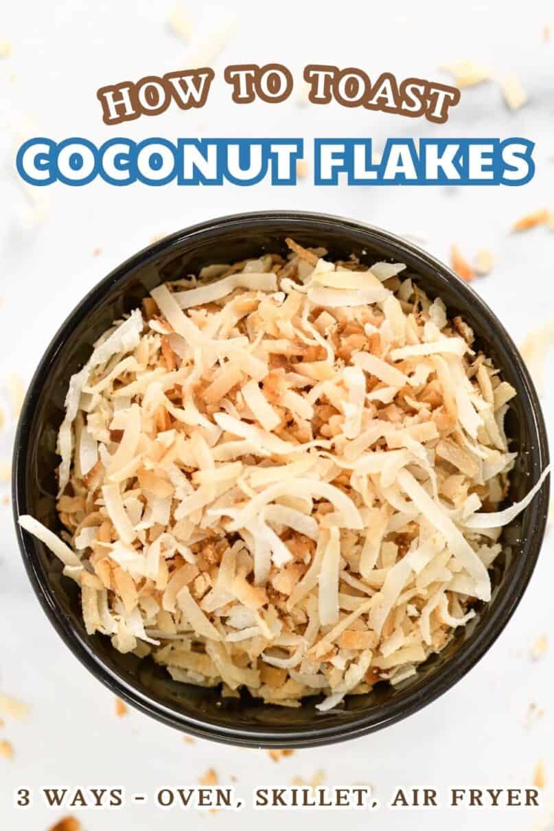 Toasted coconut in a small black bowl on a marble counter with toasted coconut scattered across the surface. with text overlay reading how to toast coconut flakes