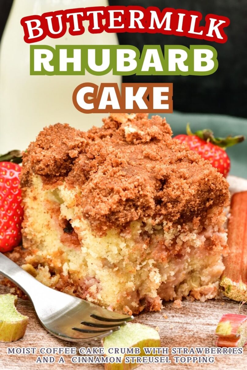 Square slice of coffee cake on a wood platter next to a silver fork and fresh strawberries and rhubarb and a glass of milk in the background with text overlay saying buttermilk rhubarb cake
