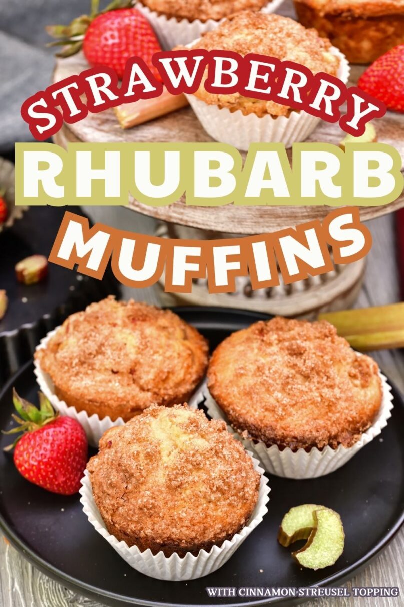 3 muffins on a black plate next to a small wood cake platter holding another muffin surrounded by fresh strawberries and rhubarb with text overlay saying Strawberry Rhubarb Muffins