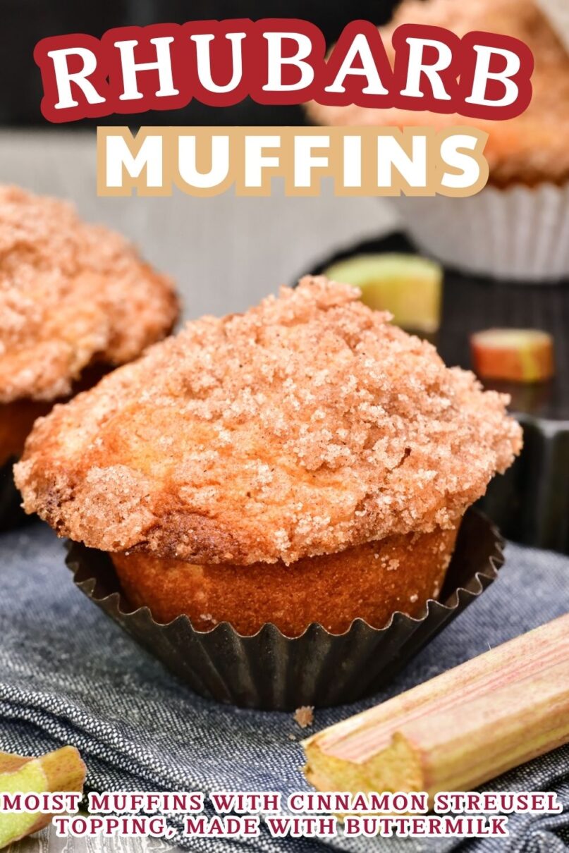 two rhubarb muffins next to old fashioned tin muffin liners and fresh chopped rhubarb on a wooden surface with text overlay saying Rhubarb Muffins